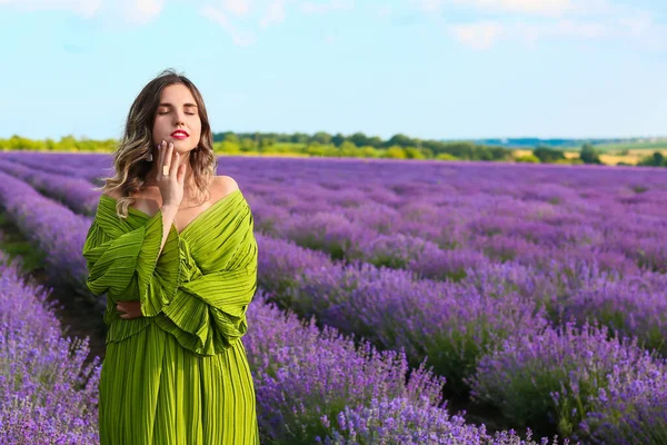 Beautiful young woman in lavender field