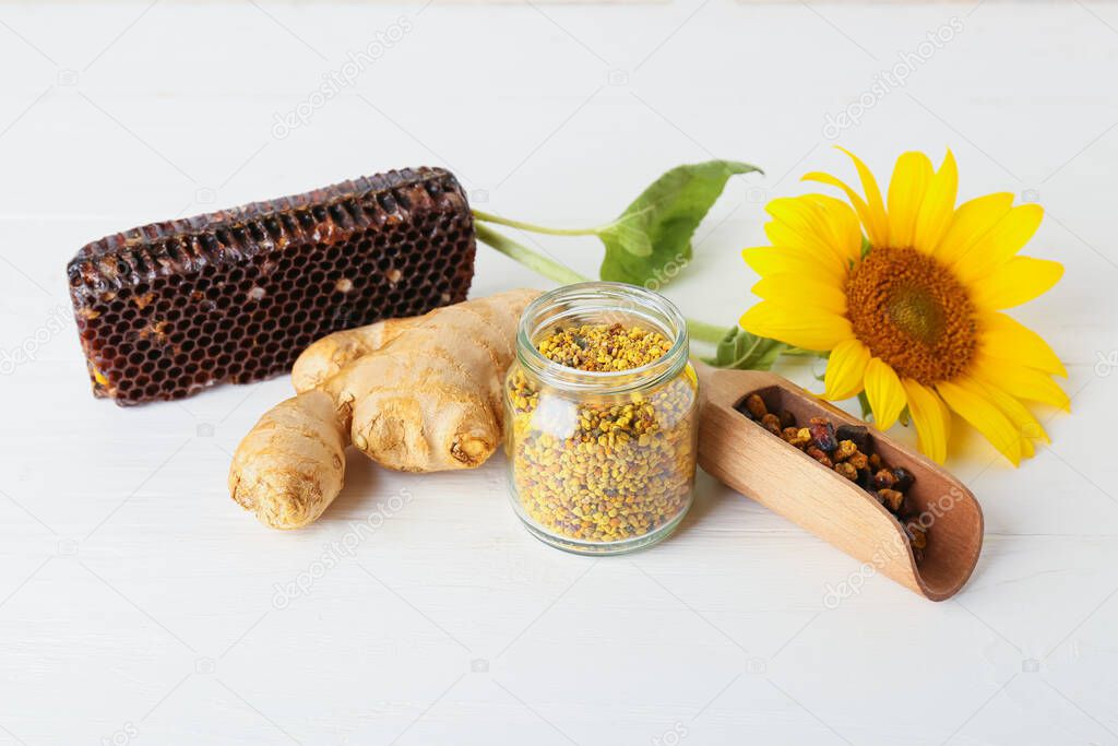 Bee pollen with beebread and ginger on table