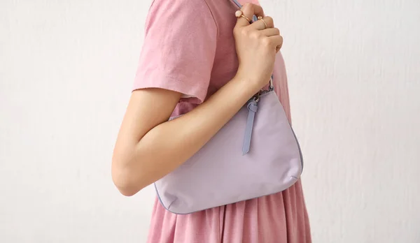 Fashionable Young Woman Holding Trendy Handbag Light Background — Stock Photo, Image