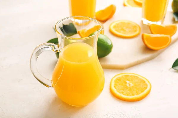 Jug Tasty Orange Juice Light Background Closeup — Stock Photo, Image