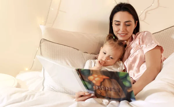 Mother Little Baby Reading Book Bed — Stock Photo, Image