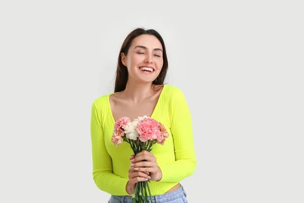 Young Woman Beautiful Carnation Flowers Light Background — Stock Photo, Image