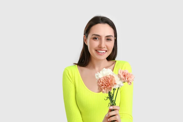 Young Woman Beautiful Carnation Flowers Light Background — Stock Photo, Image