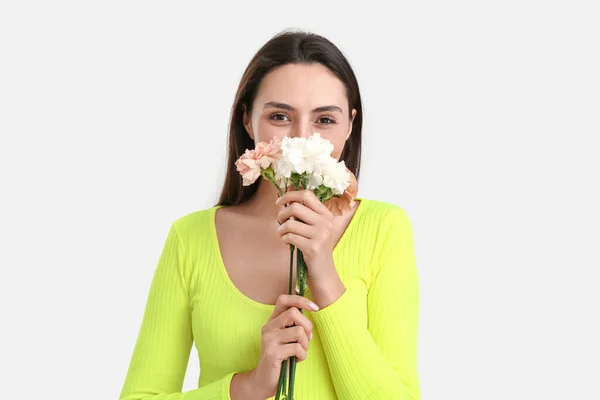 Young Woman Beautiful Carnation Flowers Light Background — Stock Photo, Image
