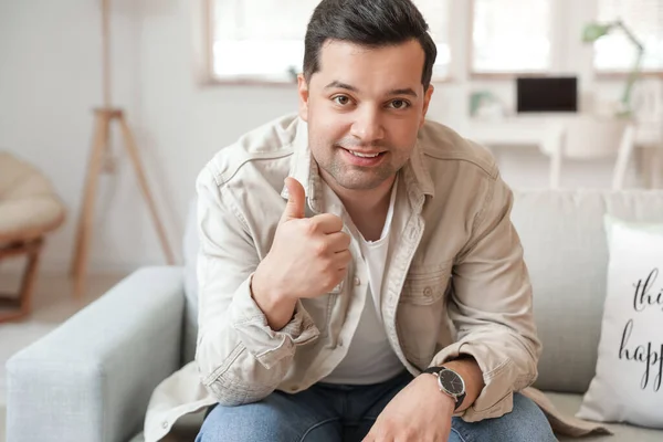 Young Man Showing Thumb Home — Stock Photo, Image