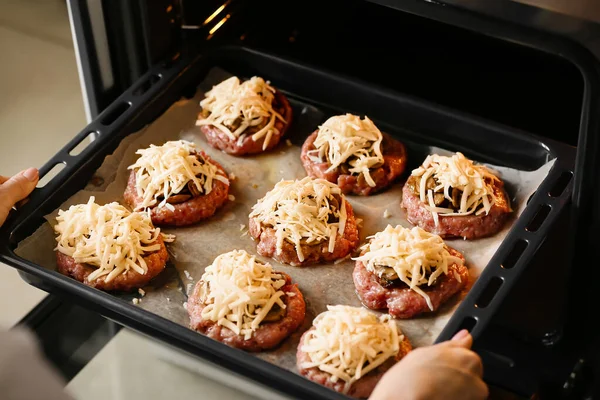 Woman Putting Baking Tray Minced Meat Boats Mushrooms Cheese Oven — Stock Photo, Image