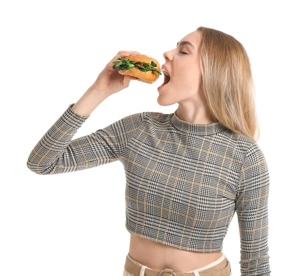 Mujer Joven Comiendo Sabrosa Hamburguesa Vegana Sobre Fondo Blanco —  Fotos de Stock