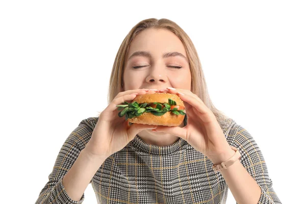 Junge Frau Isst Leckeren Veganen Burger Auf Weißem Hintergrund — Stockfoto