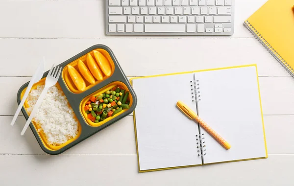 Lunch Box Tasty Food Notebook Pen Keyboard Light Wooden Background — Stock Photo, Image