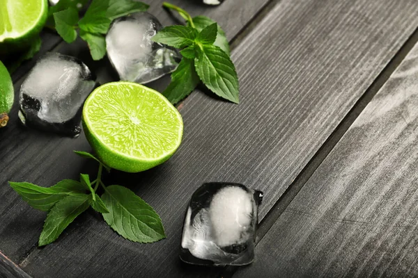 Tasty Limes Ice Cubes Dark Wooden Background — Stock Photo, Image