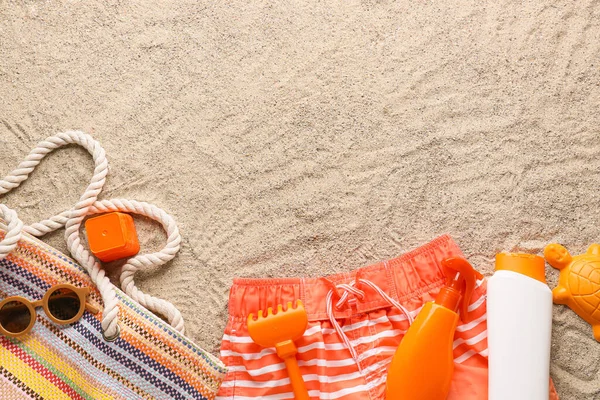 Set Beach Accessories Children Swimsuit Bottles Sunscreen Sand Closeup — Stock Photo, Image