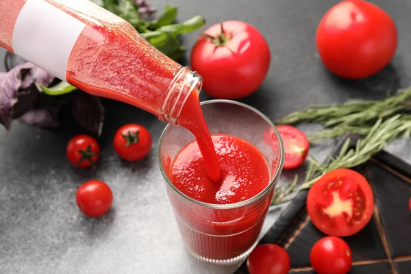 Pouring Tasty Tomato Juice Bottle Glass Grey Background — Stock Photo, Image