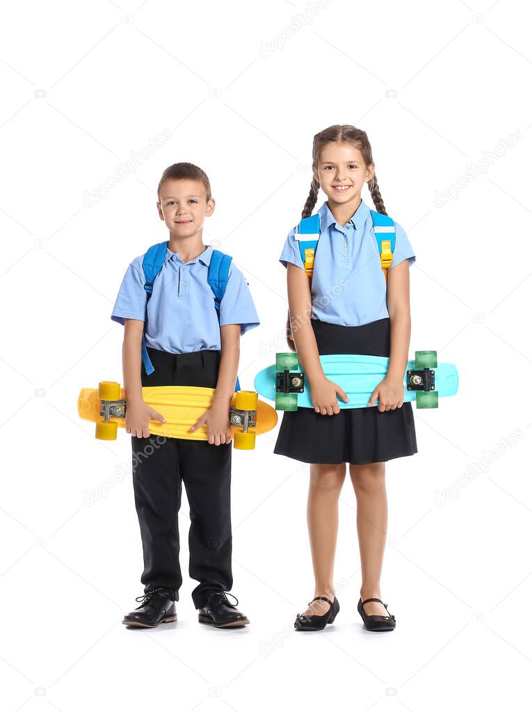 Cute pupils with skateboards on white background