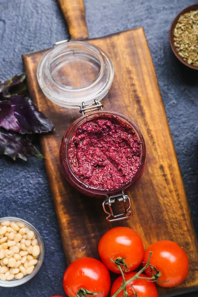 Composition Jar Tasty Pesto Sauce Ingredients Dark Background Closeup — Stock Photo, Image