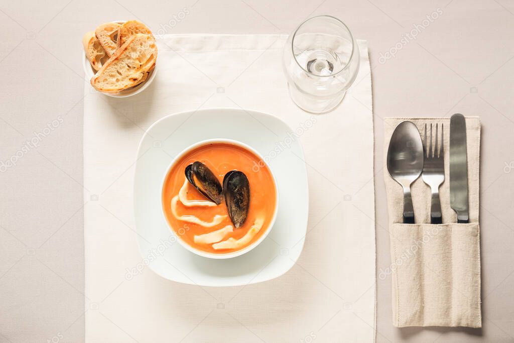 Bowl with tasty Cacciucco soup on table