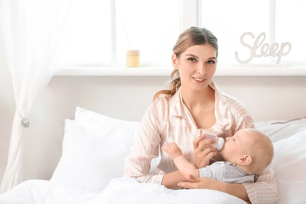 Young Mother Giving Water Her Cute Baby Bedroom — Stock Photo, Image
