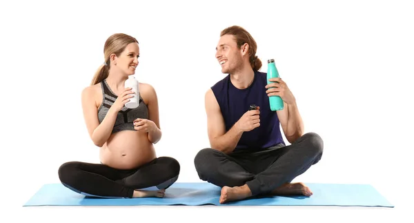 Young Pregnant Woman Her Husband Practicing Yoga White Background — Stock Photo, Image