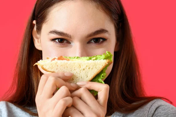 Young Woman Tasty Sandwich Color Background — Stock Photo, Image