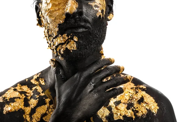 Knappe Jongeman Met Zwarte Gouden Verf Lichaam Tegen Witte Achtergrond — Stockfoto