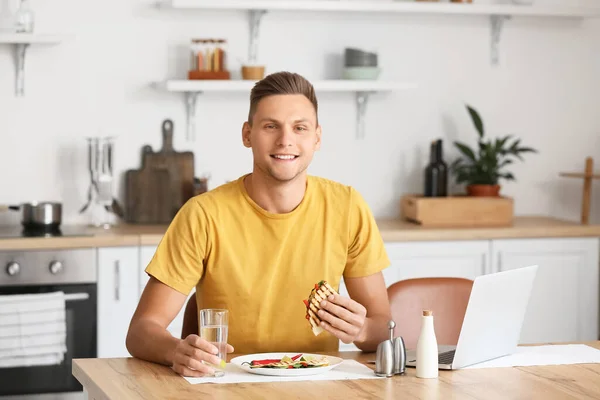 Handsome Young Man Eating Tasty Quesadilla Home — Stock Photo, Image