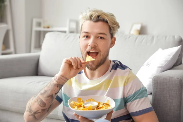 Handsome Young Man Eating Tasty Nachos Home — Stock Photo, Image