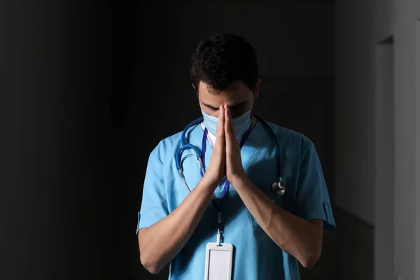 Praying Male Doctor Dark Background — Stock Photo, Image
