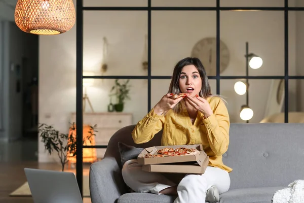 Surprised Young Woman Eating Tasty Pizza Home Evening — Stock Photo, Image