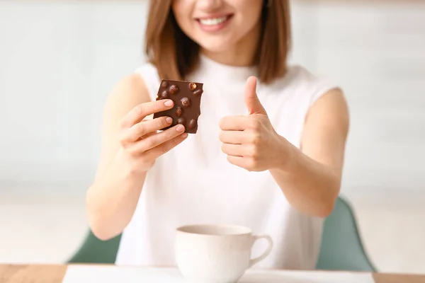 Beautiful Young Woman Tasty Chocolate Showing Thumb Home — Stock Photo, Image