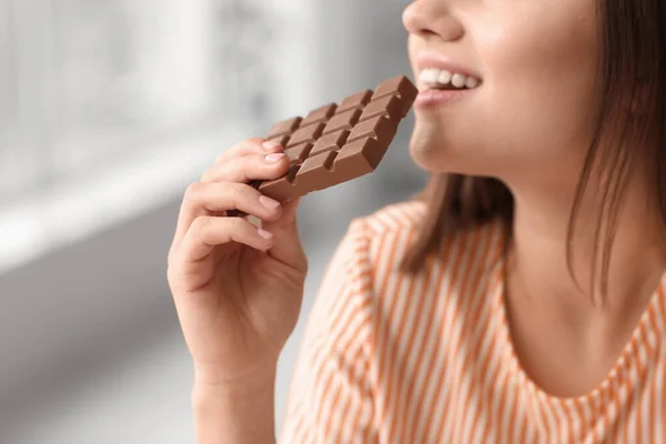 Beautiful Young Woman Eating Tasty Chocolate Home Closeup — Stock Photo, Image