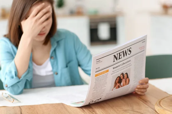 Upset Young Woman Reading Newspaper Home — Stock Photo, Image