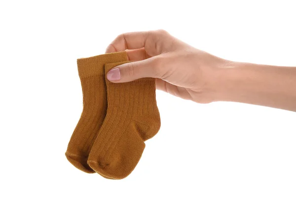 Femme Tenant Des Chaussettes Bébé Sur Fond Blanc — Photo