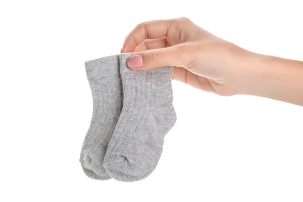 Femme Tenant Des Chaussettes Bébé Sur Fond Blanc — Photo