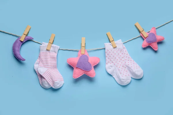 Baby Socks Toys Hanging Rope Color Background — Stock Photo, Image