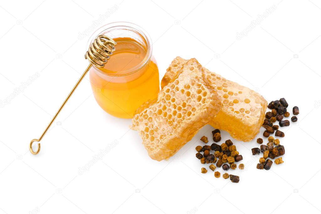 Jar of honey with honeycombs and beebread on white background