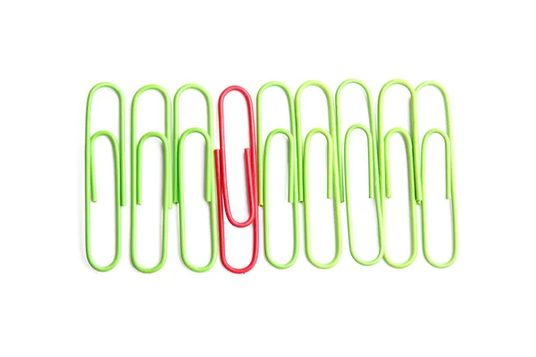 Red Paper Clip Green Ones White Background Concept Uniqueness — Stock Photo, Image