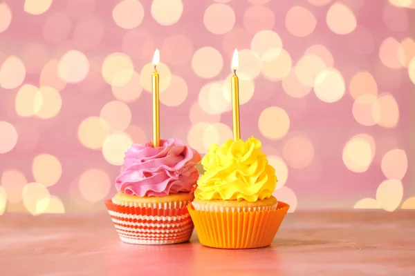 Tasty Birthday Cupcakes Burning Candles Table Blurred Lights — Stock Photo, Image