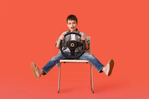 Little Boy Steering Wheel Sitting Chair Color Background — Stock Photo, Image