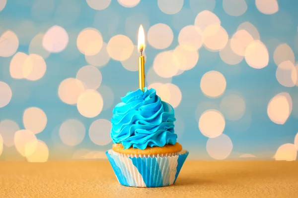 Tasty Birthday Cupcake Burning Candle Table Blurred Lights — Stock Photo, Image