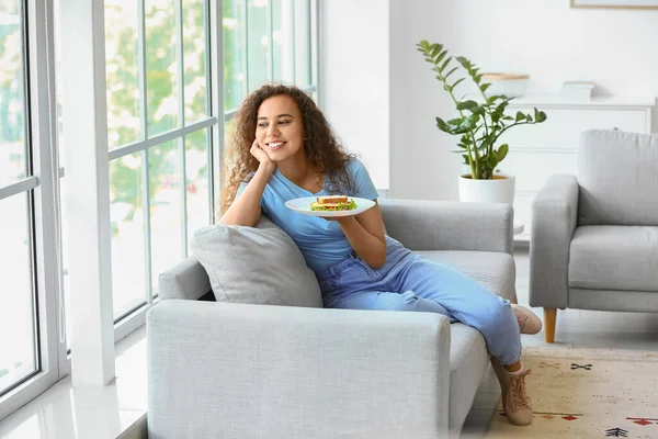 Young African American Woman Tasty Sandwich Home — Stock Photo, Image