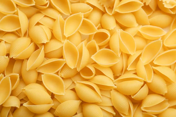 Uncooked Conchiglioni Pasta Background — Stock Photo, Image