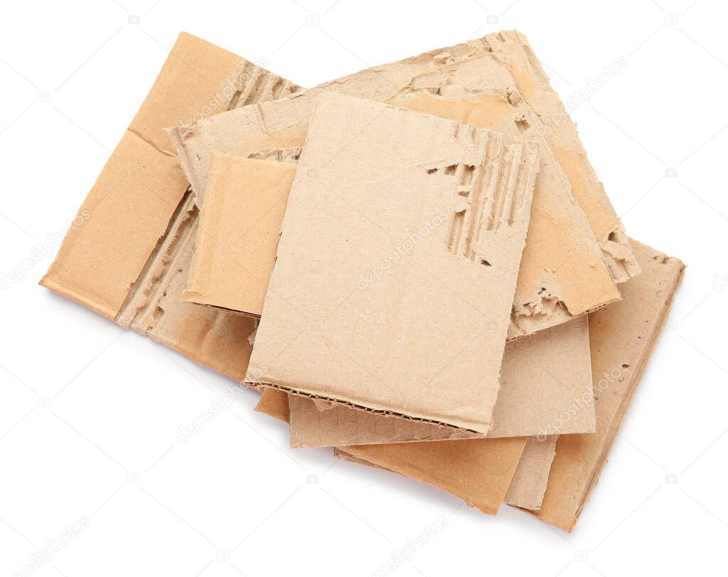 Pieces of cardboard on white background