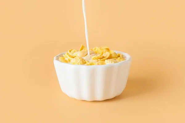 Pouring Milk Bowl Tasty Cornflakes Color Background — Stock Photo, Image