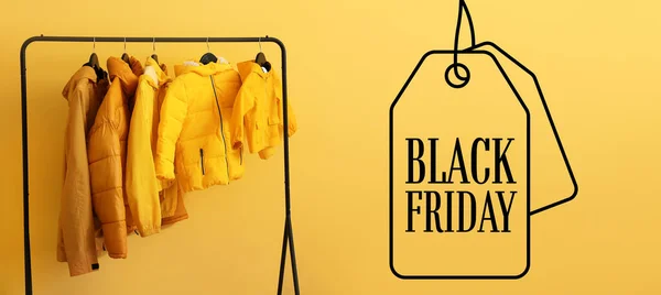Rack Stylish Clothes Text Black Friday Color Background — Stock Photo, Image