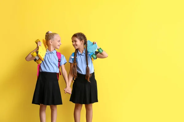 Cute Schoolgirls Skateboards Color Background — Stock Photo, Image