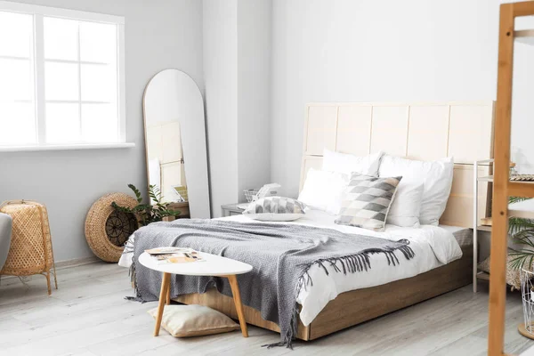 Interior of modern bedroom with mirror