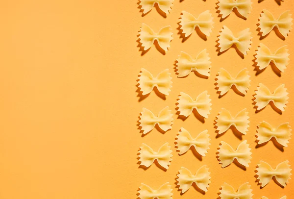 Uncooked Farfalle Pasta Color Background — Stock Photo, Image