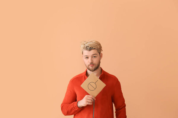 Non-binary young man on color background