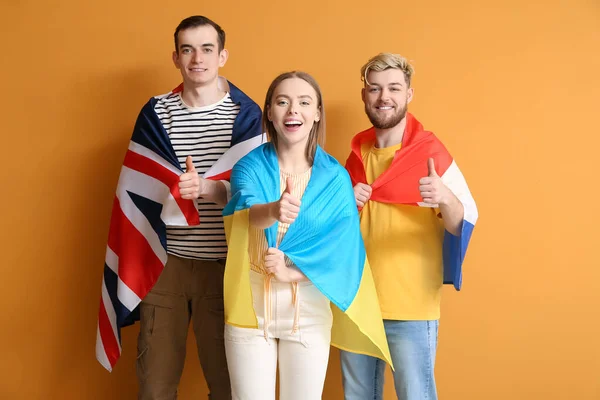 Young People Different Flags Showing Thumb Color Background — Stock Photo, Image