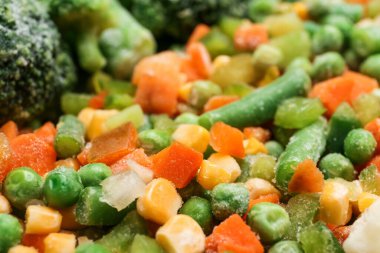 Arka plan olarak farklı donmuş sebzeler, yakın plan