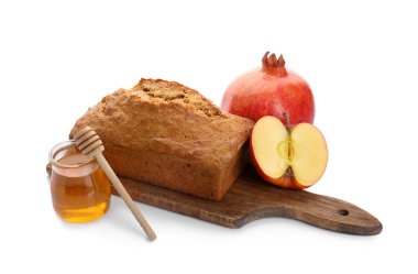Ballı ekmek, nar ve beyaz arka planda elma. Rosh hashanah (Yahudi Yeni Yılı) kutlaması